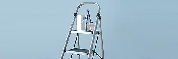 Paint pot sitting on ladder