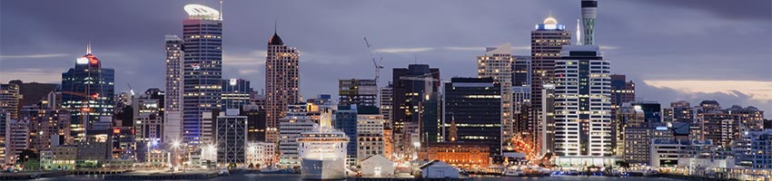 Auckland City seen from the harbour at dusk